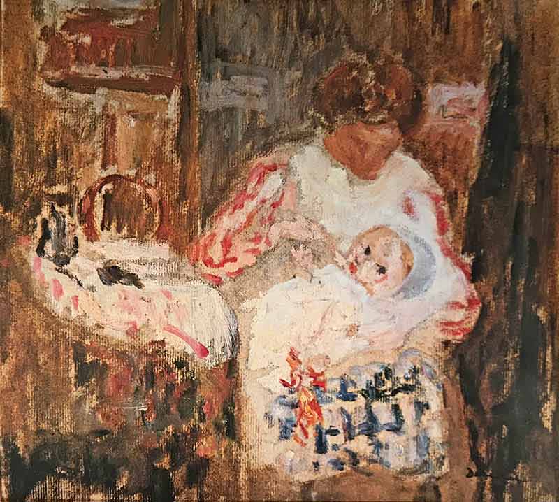 Seated woman in an interior nursing a baby on her lap next to a crib.